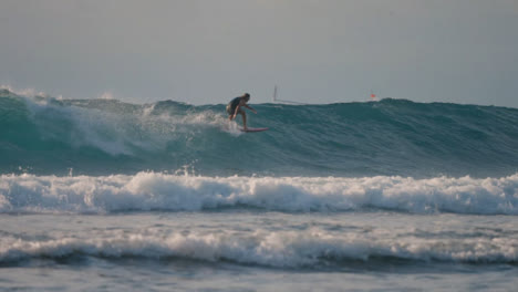 Long-Shot-of-a-Surfer-Surfing-in-the-Sea-in-Bali
