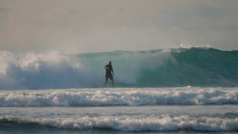 Long-Shot-of-Surfer-Surfing-and-Coming-off-Board-in-Bali