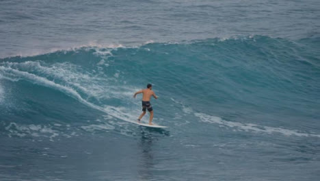 Long-Shot-of-a-Male-Surfer-Surfing-in-the-Ocean-in-Bali