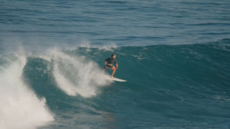 Long-Shot-of-Male-Surfer-Surfing-in-Ocean-in-Bali
