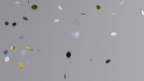 Stationary-Shot-of-Silver-and-Gold-Confetti-Falling-Against-Grey-Background