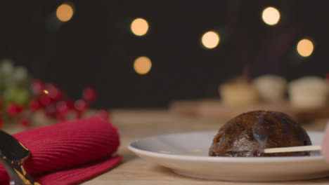 Close-Up-Shot-of-Christmas-Pudding-Being-Lit-with-Match