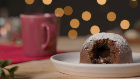 Close-Up-Shot-of-Christmas-Pudding-On-Rustic-Table