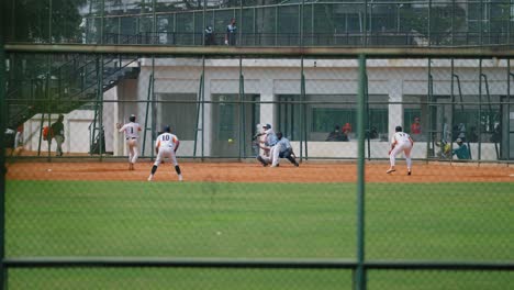 Wide-Shot-of-Young-Men-Playing-Softball-In-Jakarta-