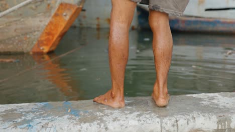 Tracking-Shot-of-Man-Washing-Legs