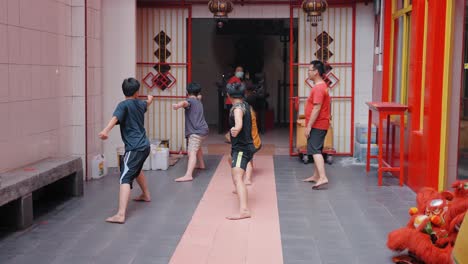 Tracking-Shot-of-Boys-Practicing-Martial-Arts