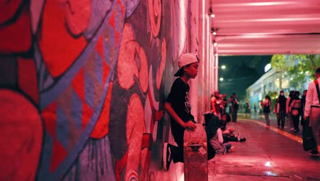 Tracking-Shot-of-Boy-Stood-with-Skateboard-in-Jakarta