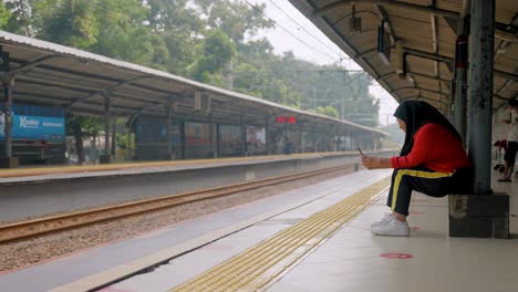 Wide-Shot-of-Woman-at-Train-Station-in-Jakarta