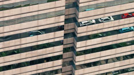 Low-Angle-Shot-of-Traffic-in-Reflection-of-Building-