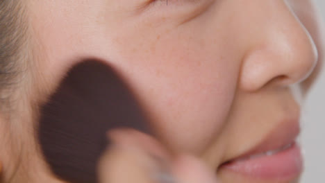 Close-Up-Shot-of-a-Young-Woman-Applying-Makeup