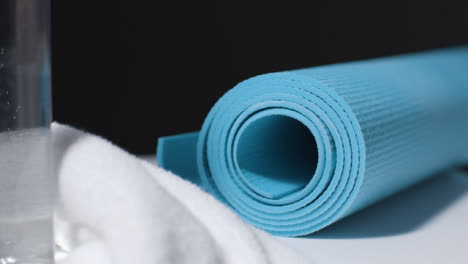 Tracking-Shot-of-Yoga-Mat-and-Water-