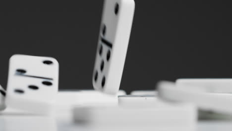 Mid-Shot-of-Person-Dropping-Dominoes