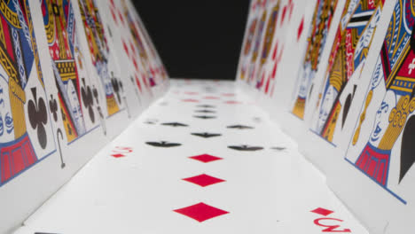 Tracking-Shot-of-Playing-Cards-Stood-Up