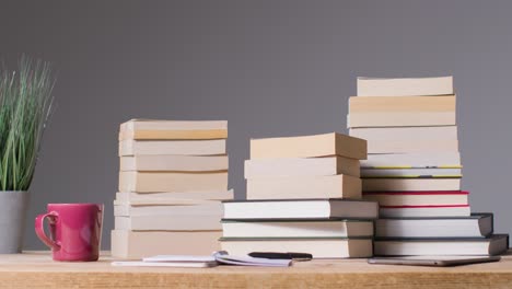 Stop-Motion-Shot-of-Books-On-a-Desk