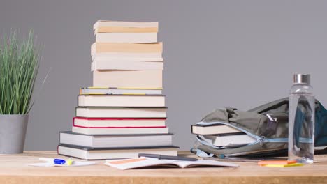 Stop-Motion-Shot-of-Books-and-Rucksack-On-Desk