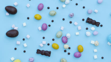 Descending-Top-Down-Shot-of-Rotating-Themed-Easter-Confectionary