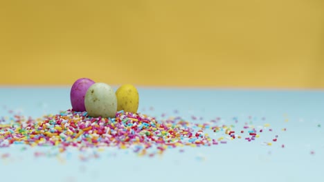 Close-Up-Shot-of-Rotating-Hundreds-and-Thousands-with-Small-Chocolate-Eggs