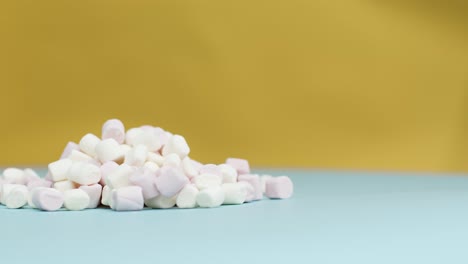 Close-Up-Shot-of-Rotating-Marshmallows-with-Copy-Space