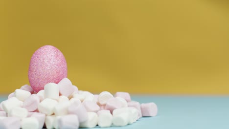 Extreme-Close-Up-Shot-of-Rotating-Marshmallows-with-Easer-Egg