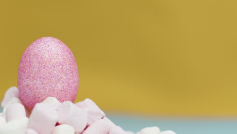Extreme-Close-Up-Shot-of-Rotating-Marshmallows-with-Small-Easer-Egg