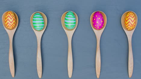 Stop-Motion-Shot-of-Easter-Eggs-In-Wooden-Spoons