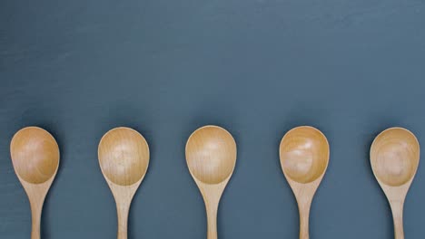 Stop-Motion-Shot-of-Easter-Eggs-In-Wooden-Spoons-with-Copy-Space