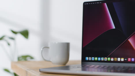 Sliding-Shot-of-Brand-New-Apple-MacBook-Pro-On-Desk-05