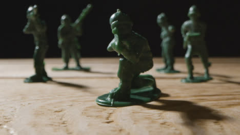 Tracking-Shot-Approaching-a-Handful-of-Toy-Soldiers