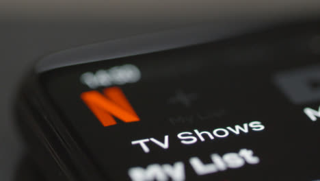 Tracking-Close-Up-of-Netflix-TV-Shows-Icon-on-Phone