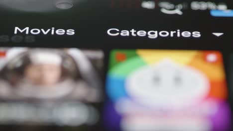 Tracking-Close-Up-of-Netflix-Categories-Menu-on-Phone