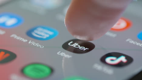 Tracking-Close-Up-to-and-Opening-Uber-on-Mobile-Phone