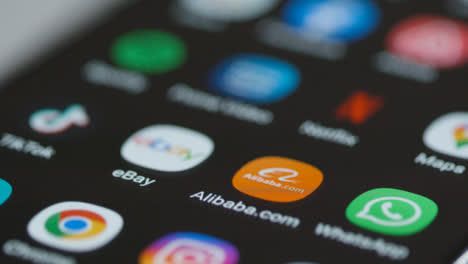 Close-Up-Orbiting-of-Alibaba-App-on-Phone