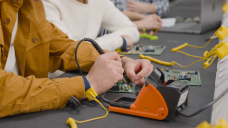 Tracking-Shot-of-Engineering-Student-Using-a-Soldering-Iron