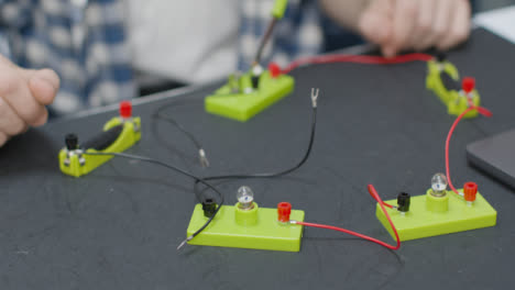 Close-Up-Shot-of-Engineering-Student-Building-Electrical-Circuit-03
