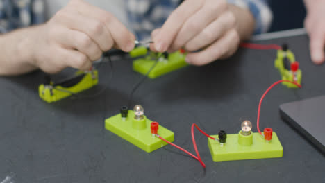 Close-Up-Shot-of-Engineering-Student-Building-Electrical-Circuit-04