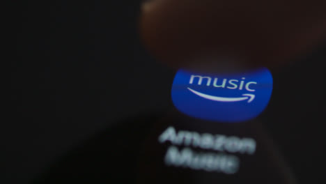 Close-Up-Shot-of-a-Finger-Tapping-Amazon-Music-On-a-Smartphone-Screen