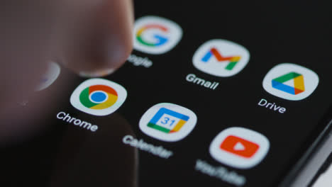 Close-Up-Shot-of-a-Finger-Tapping-Google-Chrome-App-On-a-Smartphone
