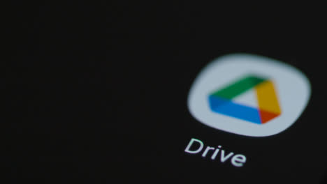 Close-Up-Shot-of-Finger-Tapping-the-Google-Drive-App-On-a-Smartphone