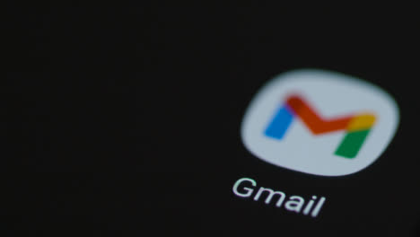 Close-Up-Shot-of-Finger-Tapping-the-Google-Mail-App-On-a-Smartphone