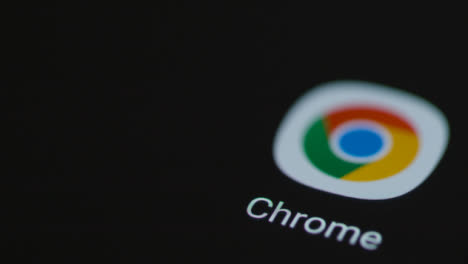 Close-Up-Shot-of-Finger-Tapping-the-Google-Chrome-App-On-a-Smartphone