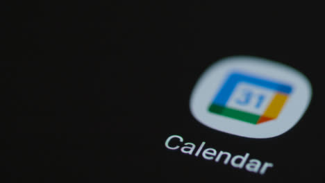 Close-Up-Shot-of-Finger-Tapping-the-Google-Calendar-App-On-a-Smartphone