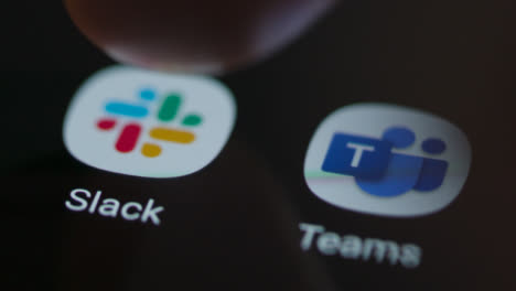 Close-Up-Shot-of-Finger-Tapping-the-Slack-App-On-a-Smartphone