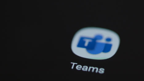 Close-Up-Shot-of-a-Finger-Tapping-the-Microsoft-Teams-App-On-a-Smartphone