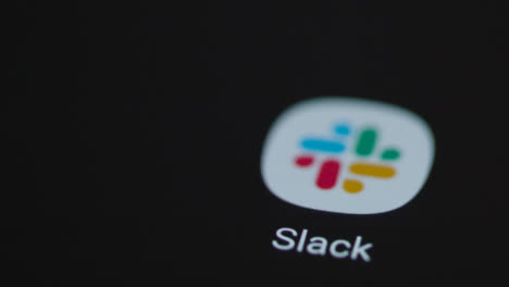 Close-Up-Shot-of-a-Finger-Tapping-the-Slack-App-On-a-Smartphone