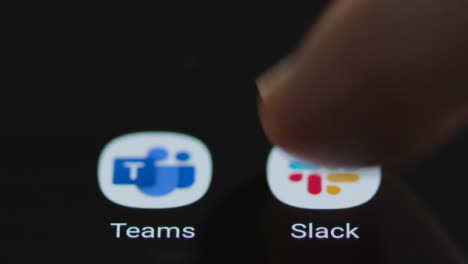 Close-Up-Shot-of-a-Finger-Tapping-the-Slack-App-On-Smartphone