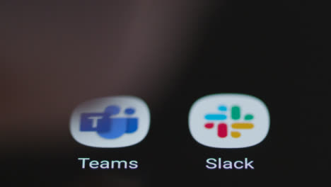 Close-Up-Shot-of-a-Finger-Tapping-the-Microsoft-Teams-App-On-Smartphone