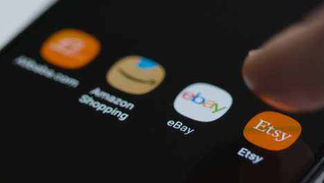Close-Up-Shot-of-Finger-Tapping-the-Etsy-App-On-Smartphone