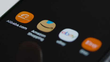 Close-Up-Shot-of-Finger-Tapping-the-Alibaba-Shopping-App-On-Smartphone