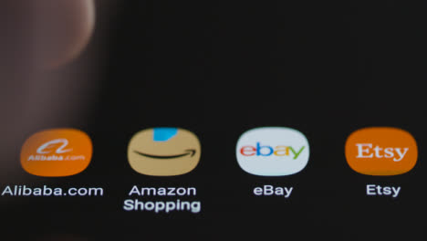 Close-Up-Shot-of-a-Finger-Tapping-the-Alibaba-Shopping-App-On-a-Smartphone