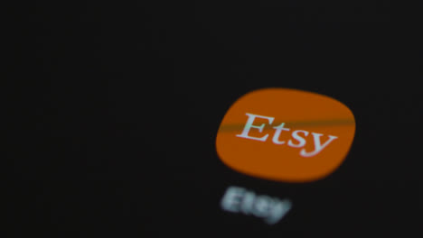 Close-Up-Shot-of-Finger-Tapping-the-Etsy-App-On-a-Smartphone-Screen